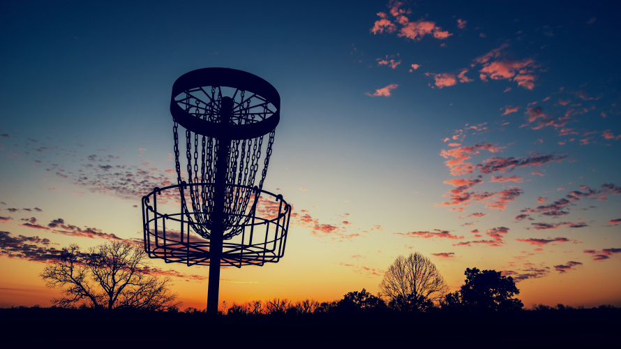 Silhouette,Of,Disc,Golf,Basket,Against,Sunset.,Vintage,Filter,Effects.